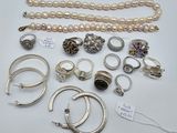 many different types of jewelry on display on the table