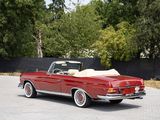 an image of a red convertible car parked in a parking lot