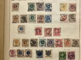 an open book with a bunch of different stamps on it