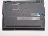 a black laptop with a blue sticker on it