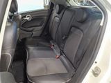 the back seats of a car with a steering wheel and a seat belt