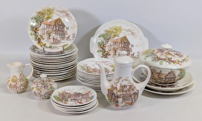 un grand nombre d'assiettes et de tasses posées sur une table