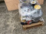 a pallet full of cans and cans of beer on the ground