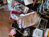 a pile of assorted items on the floor in a room
