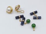 several pieces of jewelry including a pearl and a pair of earrings
