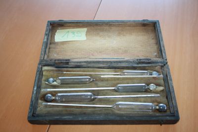 a wooden box with a bunch of tools inside of it