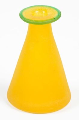 an orange vase with a green top sitting on a white surface