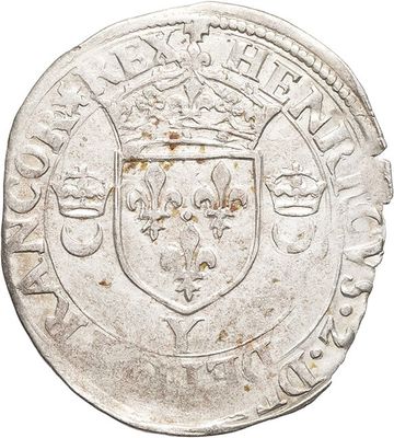 a close up of a coin with a coat of arms on it
