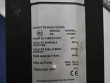 a close up of a parking meter with a sticker on it