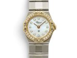 an image of a close up of a wrist watch with diamonds on it