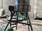 a large metal tank sitting on top of a metal stand