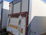 a white truck that is parked on the side of the road