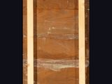 a close up of a piece of wood with a black background
