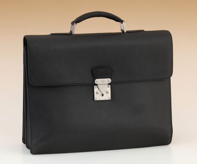 a black briefcase sitting on top of a white table