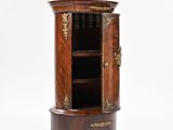 an image of a cabinet with a door and shelves