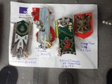 a lot of different badges on a piece of paper