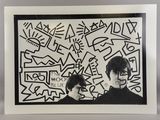 an image of a picture of a man and a woman with graffiti on the wall