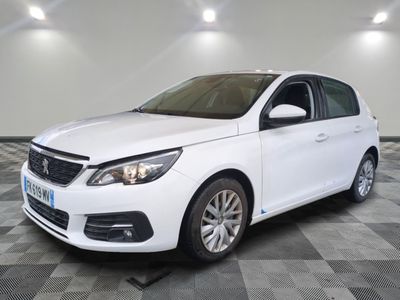 the white car is parked on a checkered tile floor