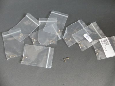 many pieces of plastic with a tag on them