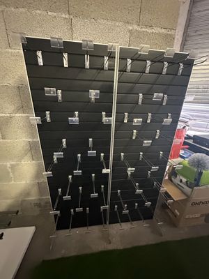 a wall of black and white boxes in a room