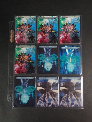 the four cards have different designs on them on a black surface