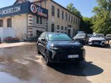 a car parked in front of a building in a parking lot