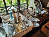 a box of silverware sitting on a window sill