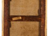 an old picture frame with a piece of wood in it
