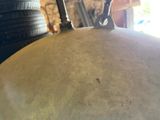 a close up of a drum with a person holding it