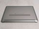 a laptop that is sitting on a table with its lid open