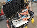 a tool box with tools in it sitting on the floor