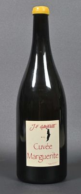 a bottle of wine sitting on a table with a label on it
