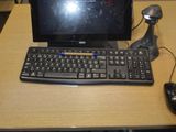 a computer on a desk with a keyboard and mouse