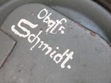 a close up of a parking meter with graffiti on it