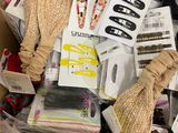 a cardboard box filled with assorted clothing and accessories