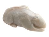 a white statue of a fish on a white background