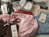 a pile of clothing that is sitting on a table