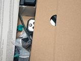 a cardboard box with a bunch of electronics inside of it
