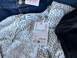 a pile of clothing that is sitting on a table