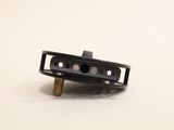 a small black object that is on a white surface
