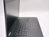 a laptop with a black keyboard on a white surface