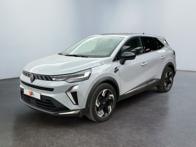 a silver suv parked in a room with a black floor