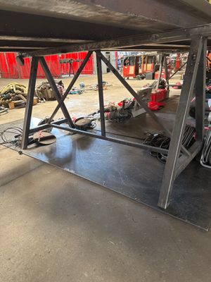 an image of a man working on a vehicle in a garage