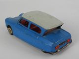 a blue toy car with a white roof on a white surface
