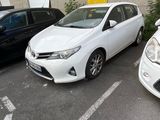 three cars parked in a parking lot next to each other