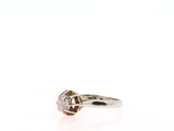 a close up of a diamond ring on a white background
