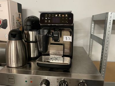 a coffee maker and a coffee pot sitting on a counter