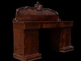 a wooden desk with a carved top and a black background