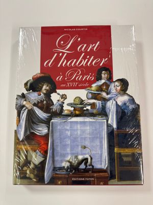 a picture of a book with a picture of a family at a table