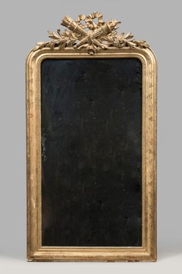an antique gold framed mirror with a black background and a gold frame